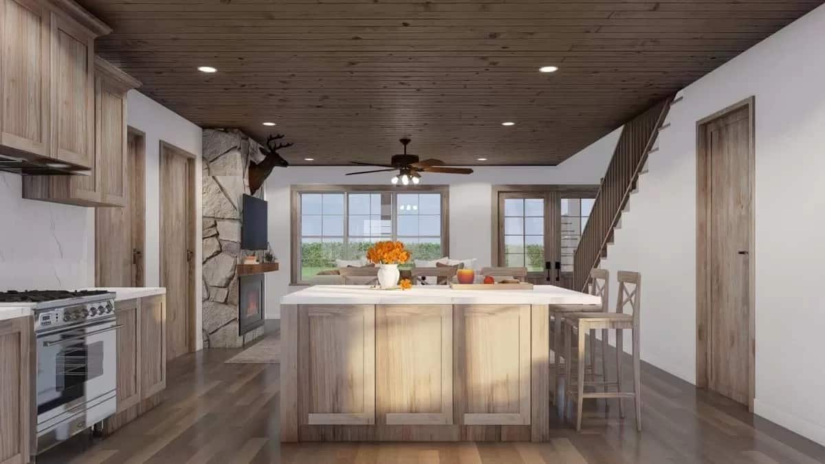 Kitchen island with casual seating overlooking the great room.