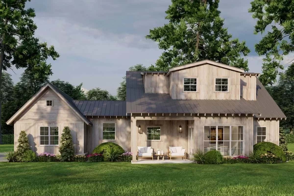 Rear view of the house with exposed rafters and a covered patio.