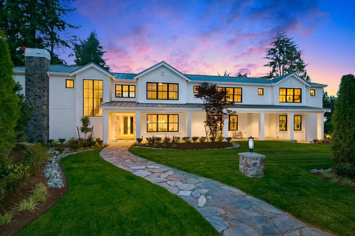 Front view of the house showcasing the expansive patio framed with decorative columns.