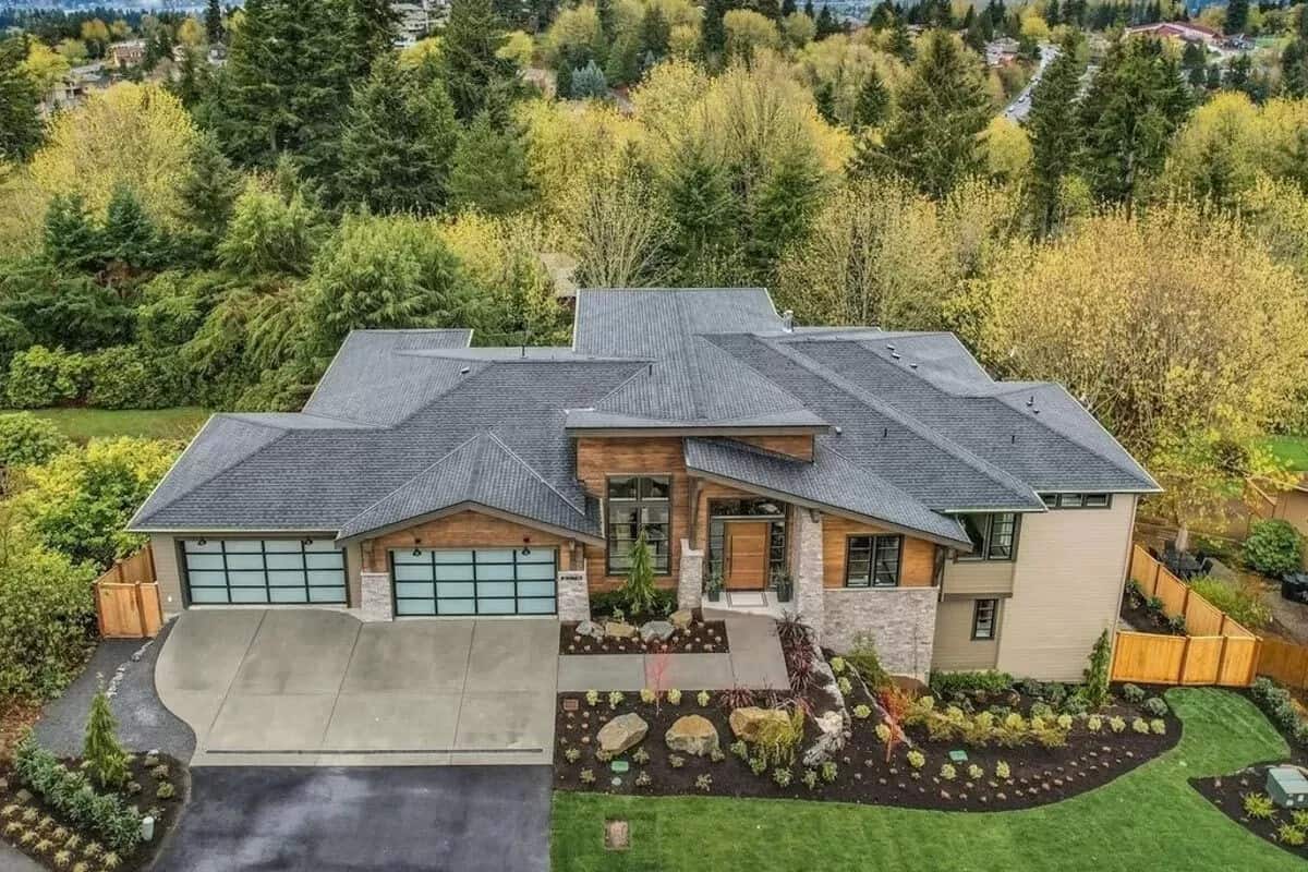Aerial front view of the three-story mountain modern home.