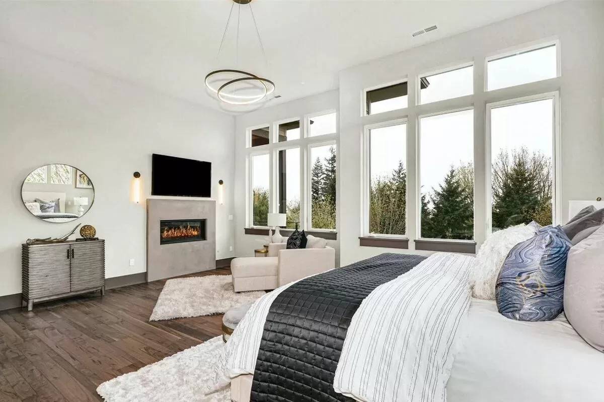 The primary bedroom includes a fireplace with a TV on top.