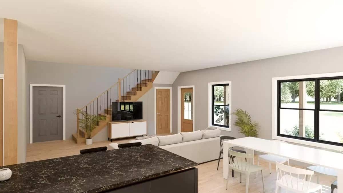 View of the dining area and living room from the kitchen.