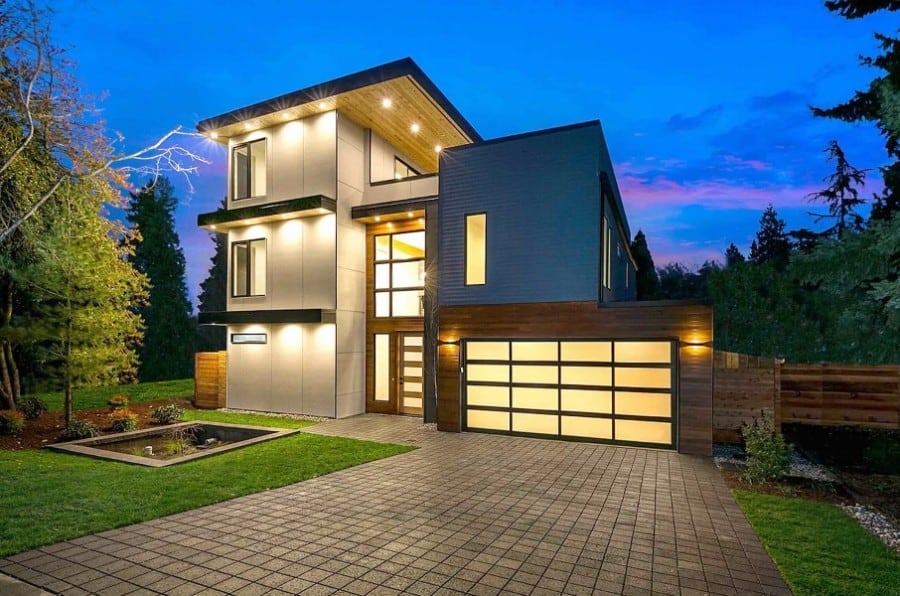 Front view with a sleek entry and a double front-facing garage.