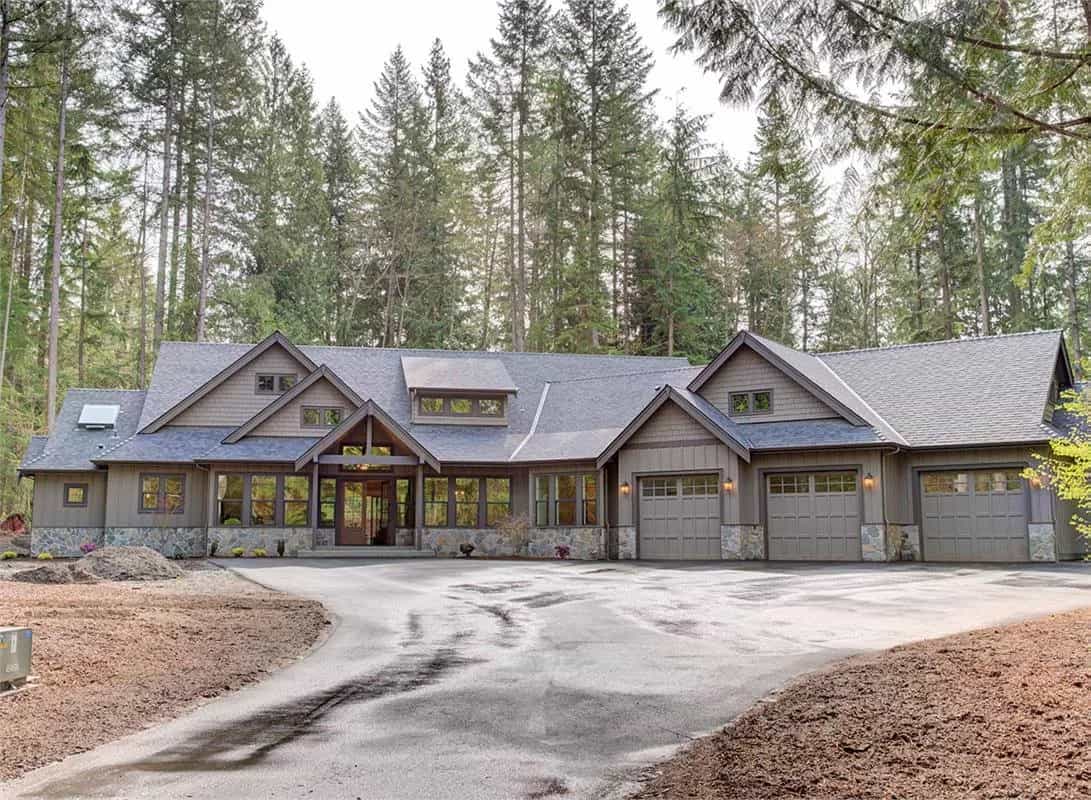 Front view of the house showcasing the vaulted entry and the angled 4-car garage.