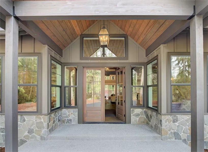 Front entry with a cathedral ceiling and a French front door.