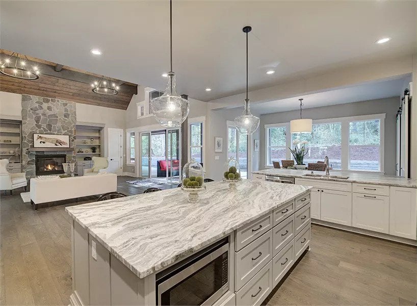 Kitchen island with a microwave overlooking the great room.