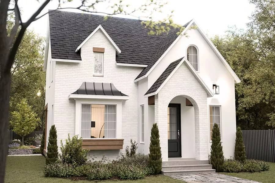 Front-left view showcasing the arched entry complemented with a concrete stoop.