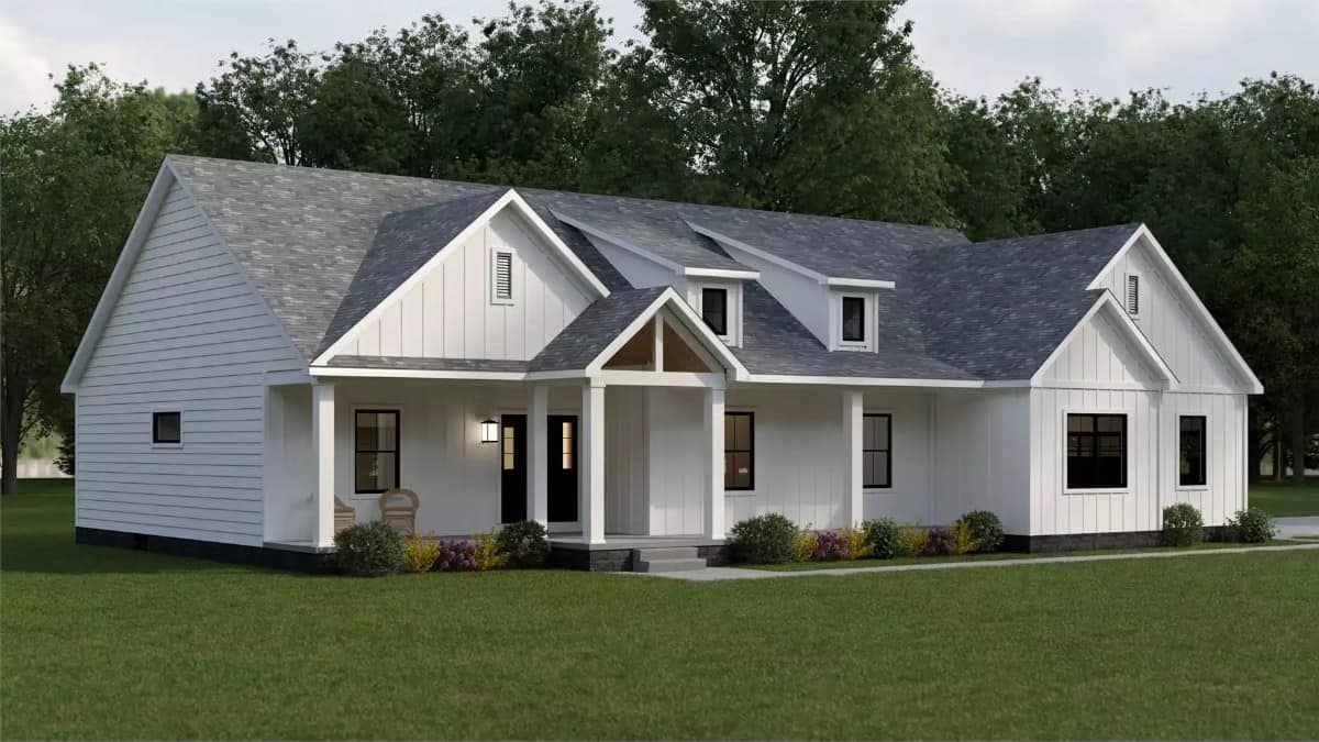 Front-left view with multiple gables and a covered entry porch topped with twin shed dormers.