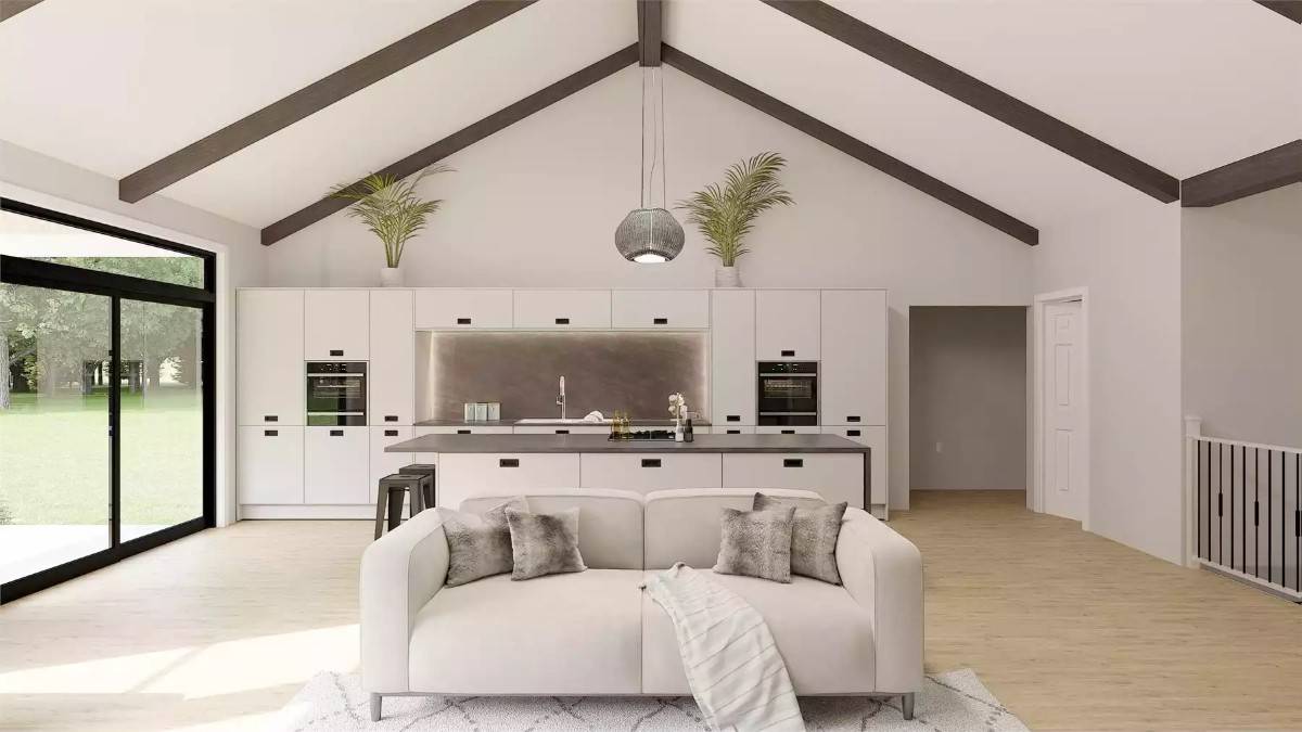 Kitchen with white cabinetry and a matching island illuminated by a pendant light.