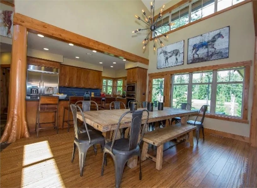 Dining room with a rectangular dining set illuminated by a sputnik chandelier.