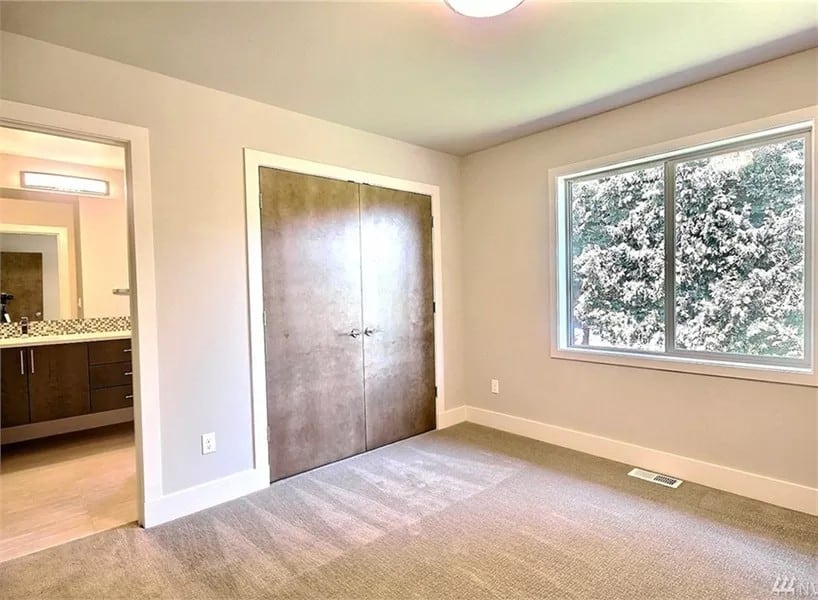 Bedroom with a built-in wardrobe and an ensuite bathroom.