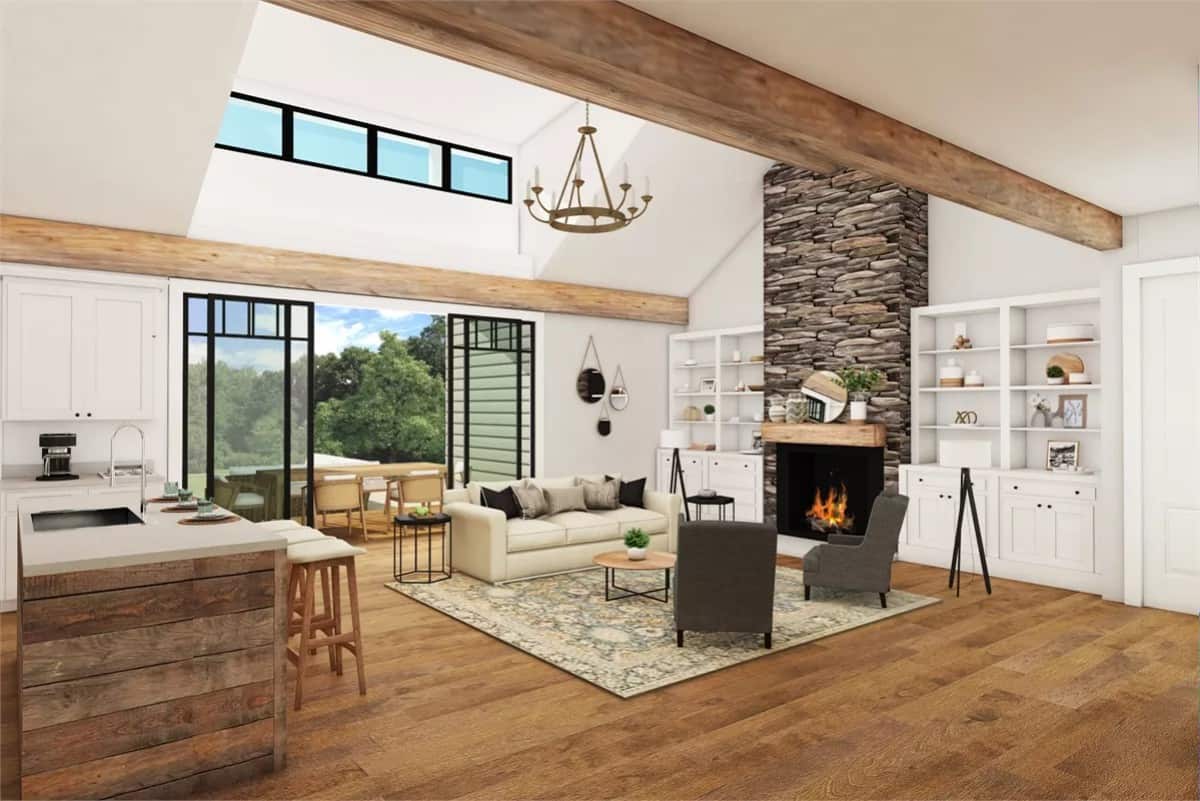Living room with modern seats and a stone fireplace flanked by white 