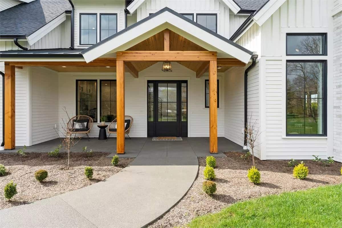 Front entry with timber posts and a glazed front door.