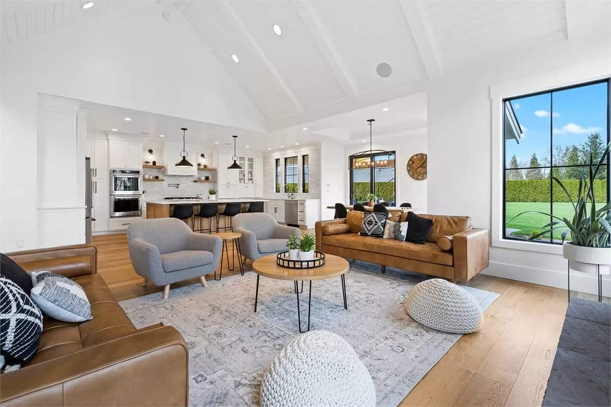 A vaulted ceiling with exposed beams crowns the great room.