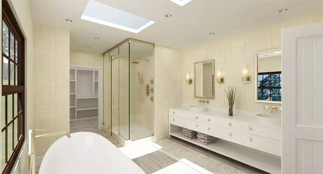 Primary bathroom with a dual sink vanity, a glass-enclosed shower, a soaking tub, and a walk-in closet.
