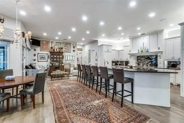 An open layout view of the kitchen, dining area, and family room.