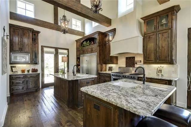 A tall beamed ceiling crowns the kitchen.