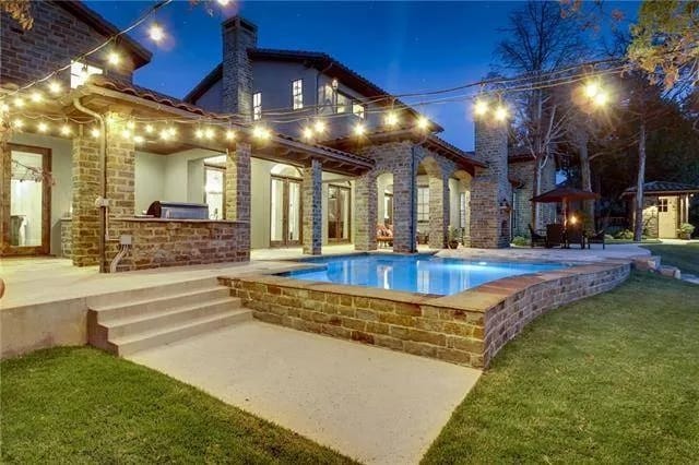 Outdoor living with covered lanais and a swimming pool.