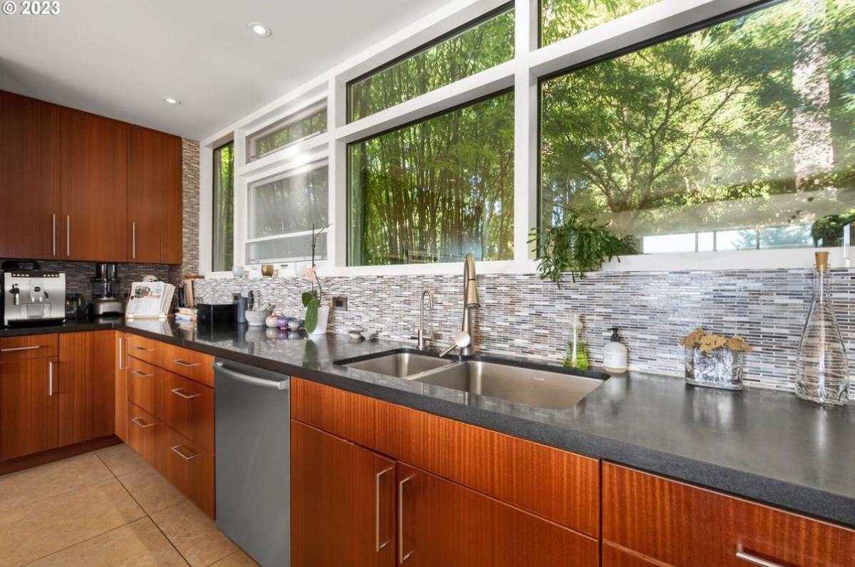 Kitchen with custom lights and custom cabinets.