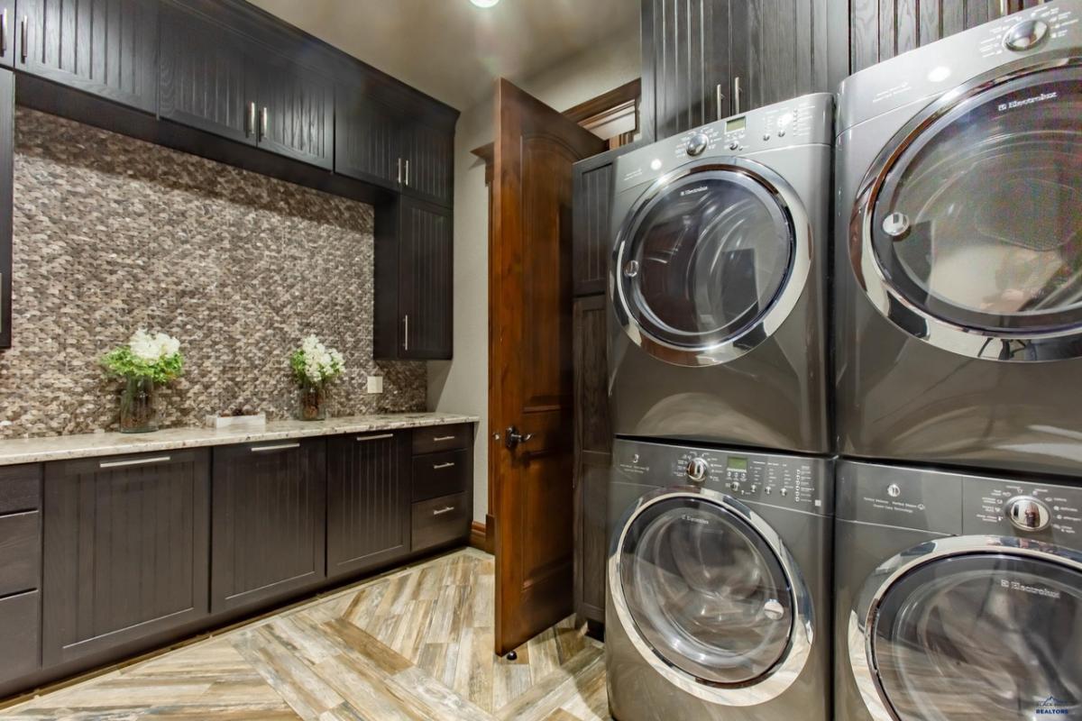 Laundry room with custom cabinets.