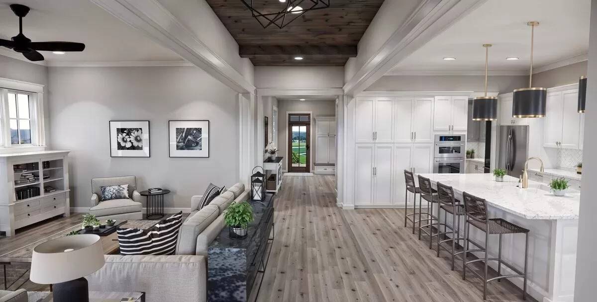 An open layout view of the great room, foyer, and kitchen.