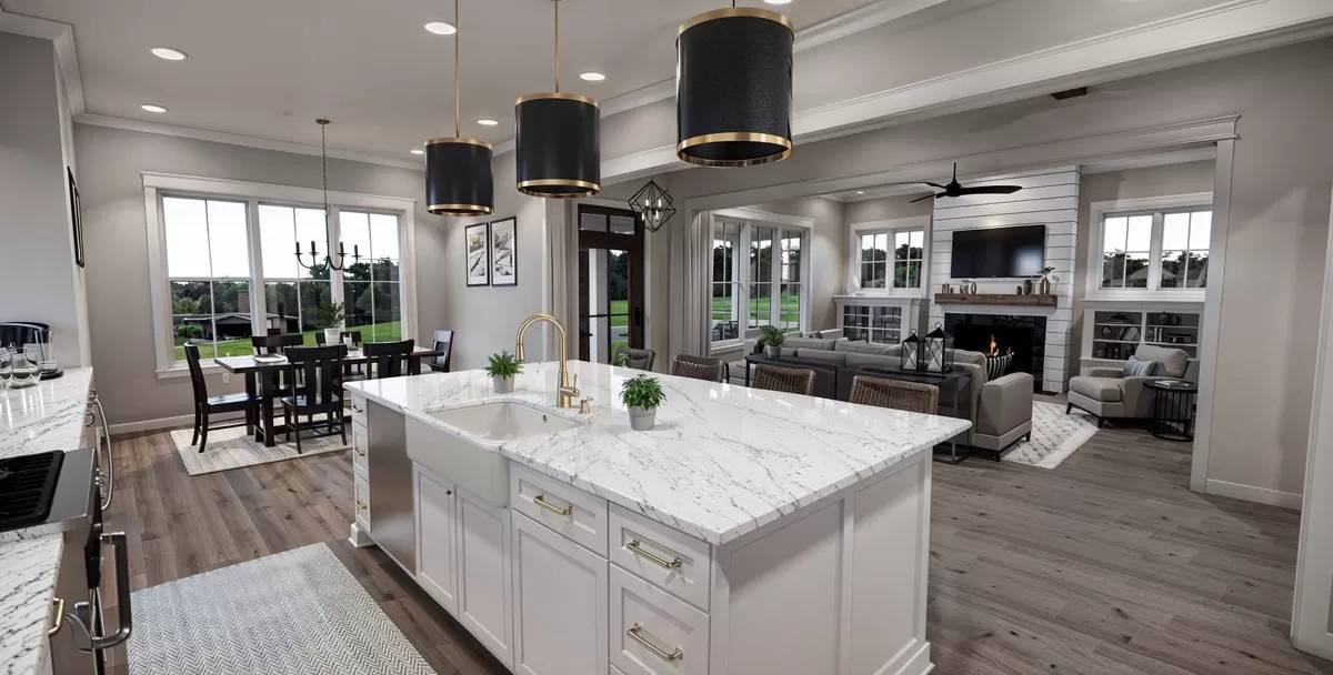 Kitchen island with a farmhouse sink and a marble countertop.