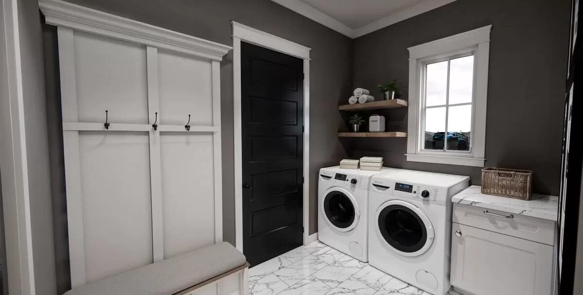 Laundry room with a marble counter, floating shelves, and a cushioned bench.