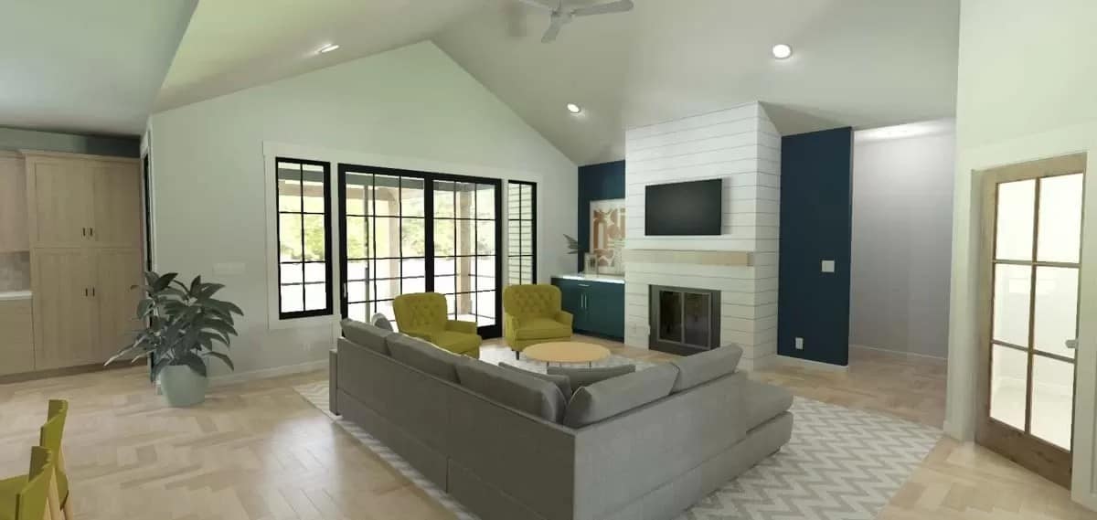 Living room with a sectional sofa and a fireplace with a TV on top.
