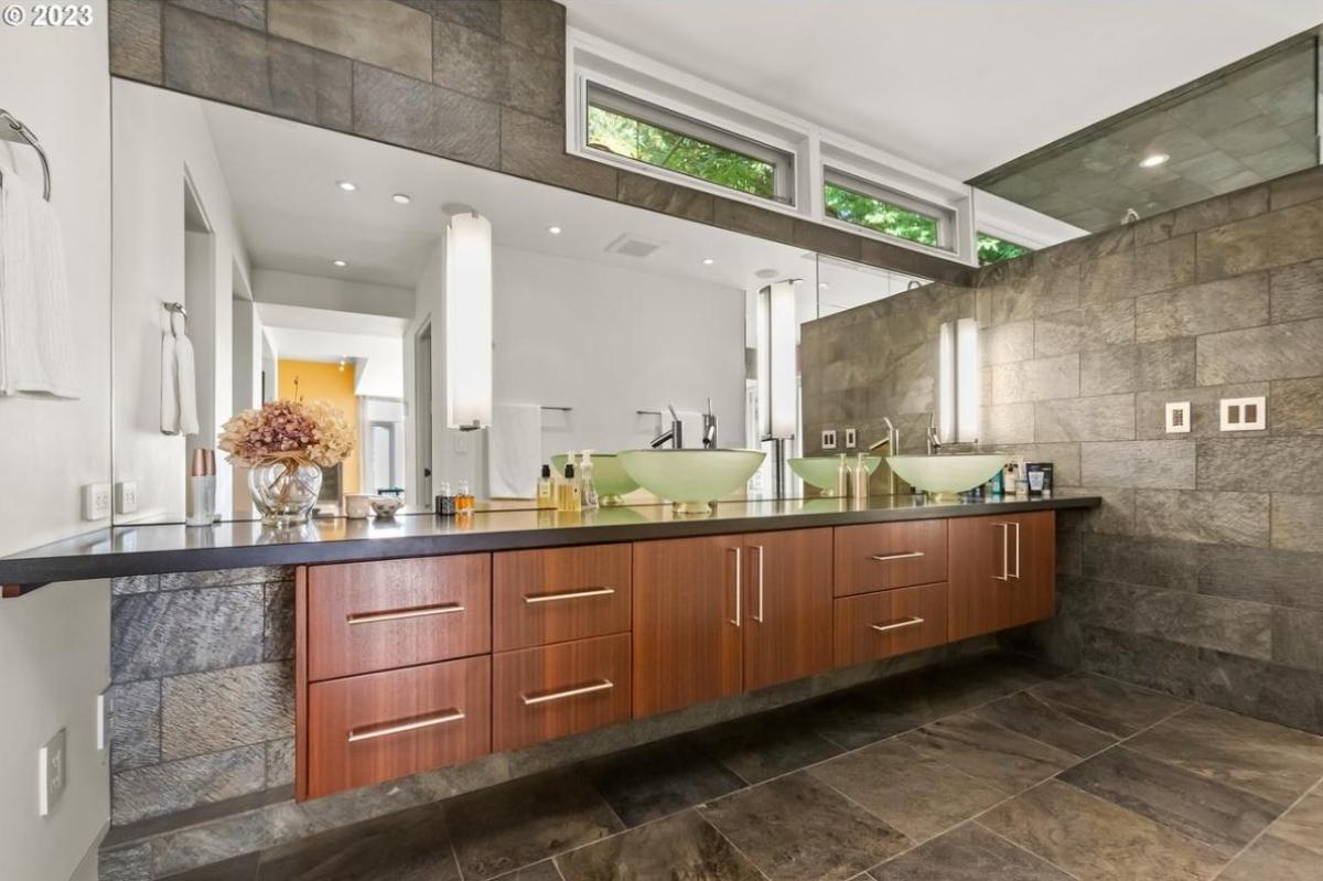 Bathroom with dual sinks and large mirrors.