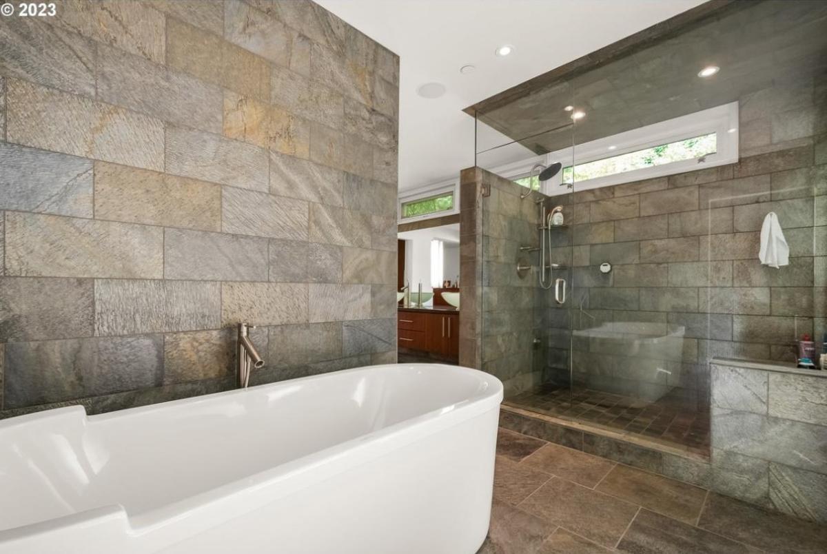 Bathroom with a soaking tub and walk-in shower.