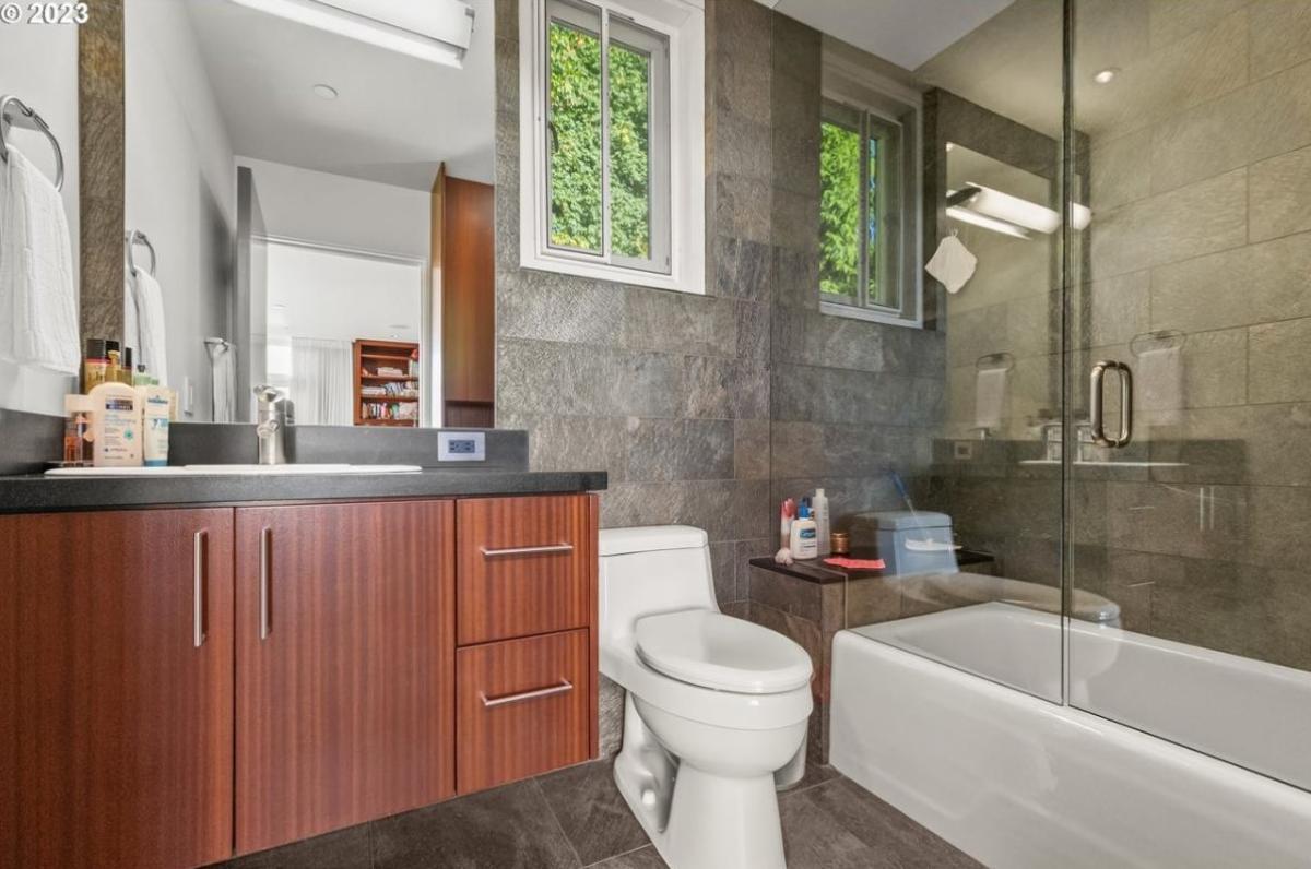 Bathroom with a sink, shower and a toilet.