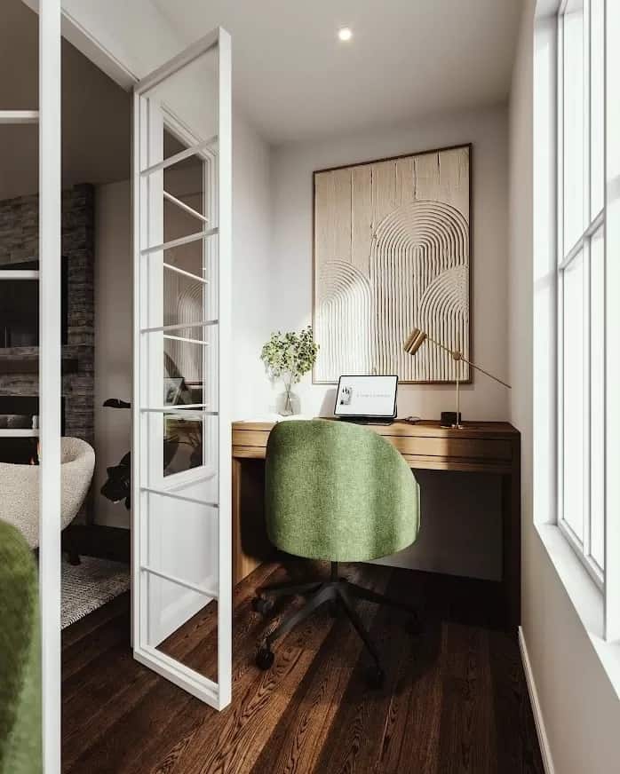 Office with a built-in desk and a round back chair.