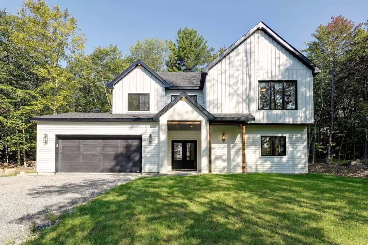 Front view with a covered entry and a double garage.