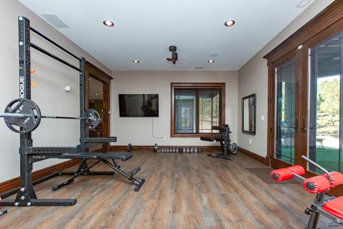 Home gym with workout equipment.