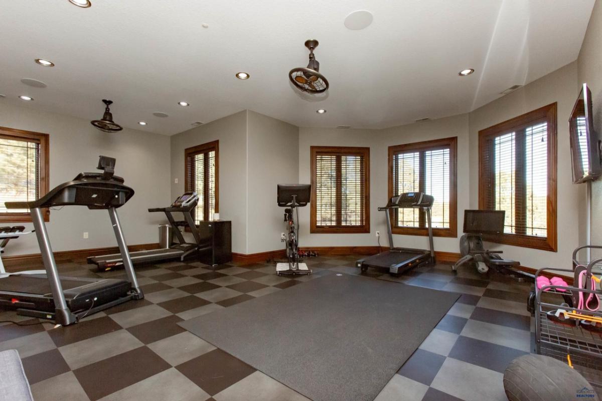 Home gym with workout equipment.