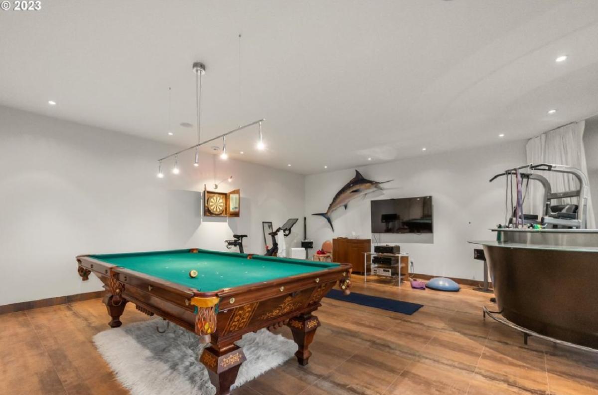Billiards room with a TV.
