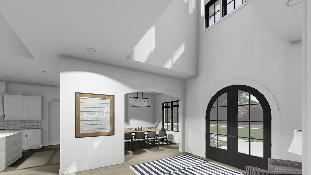 Foyer with striped rugs and a French front door.