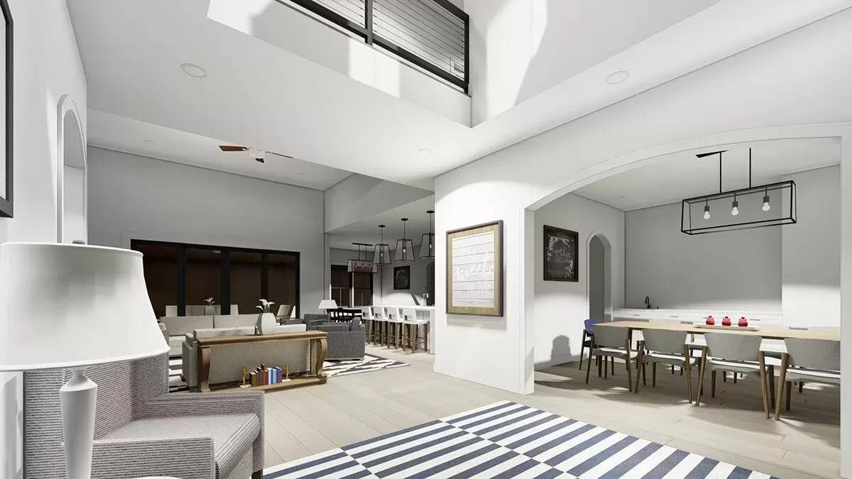 View of the dining room, living room, and kitchen from the foyer.