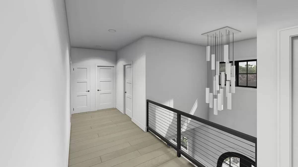 Second-level balcony with hardwood flooring and wrought iron railing.
