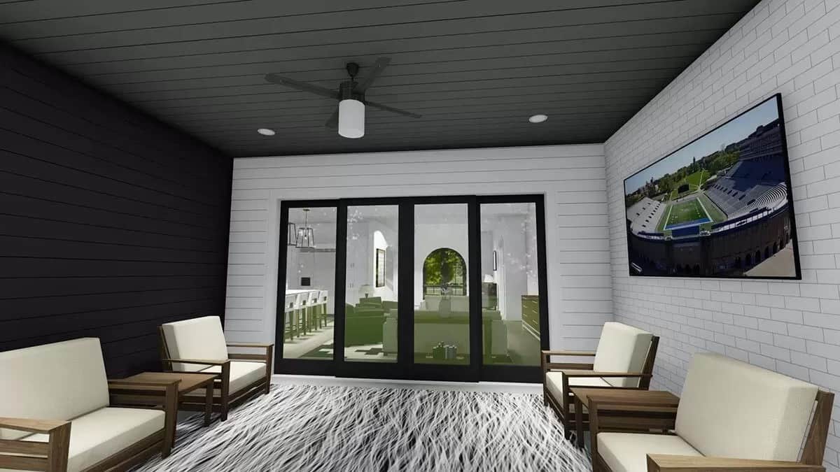 Covered patio with cushioned chairs and a wall-mounted TV.