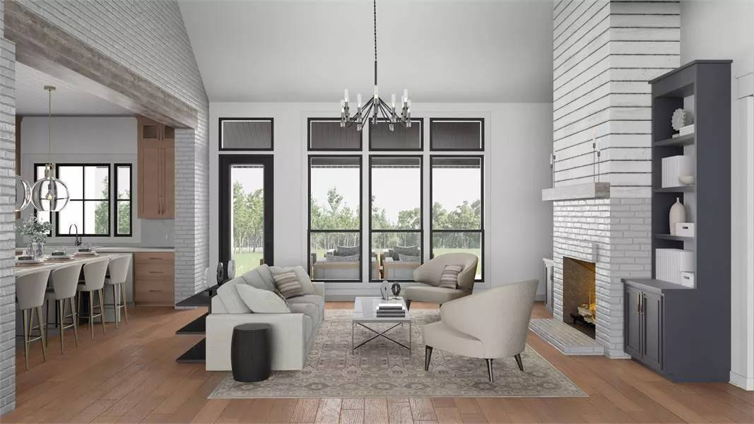 Great room with beige seats, a brick fireplace, and a wrought iron chandelier hanging from the vaulted ceiling.