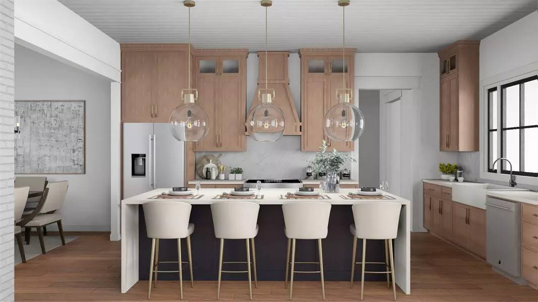 Kitchen with wooden cabinets, a farmhouse sink, modern appliances, and a waterfall island.