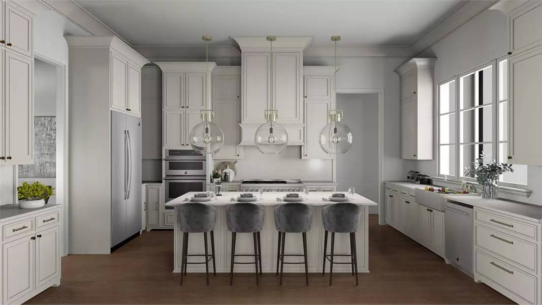 Kitchen with white cabinets, slate appliances, and a breakfast island with seating for four.