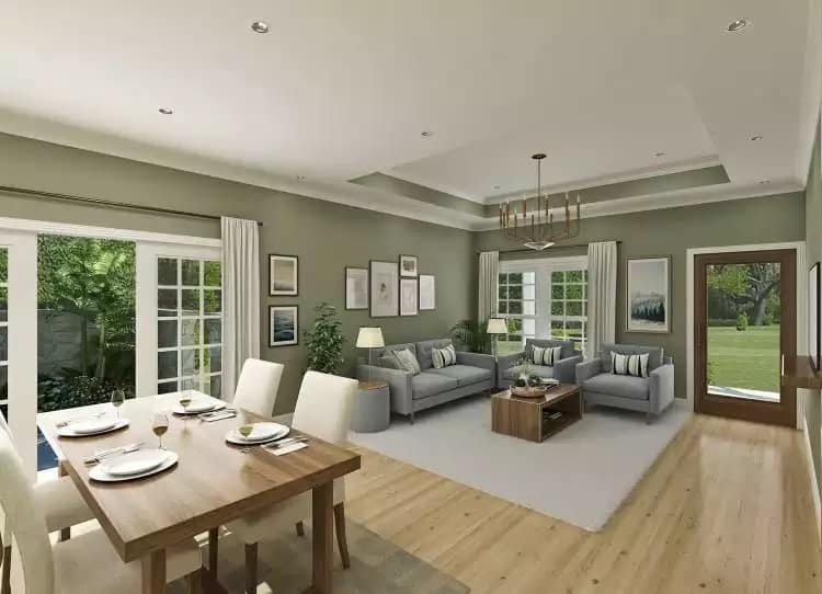 Dining area and living room with sectional sofas and wooden tables.