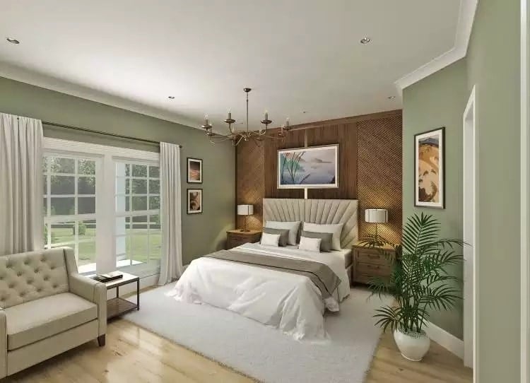 Bedroom with a wooden accent wall and large windows overlooking the covered porch.