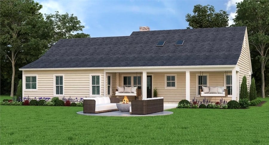 Rear view of the house with a covered patio and fire pit seating.