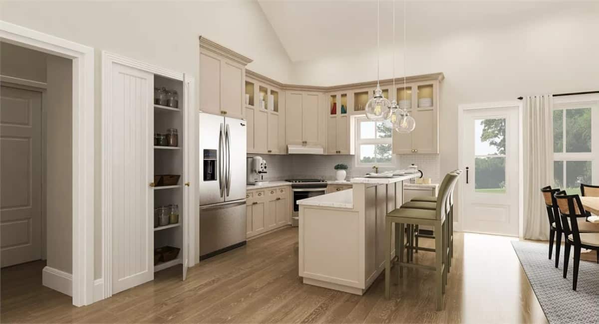 Kitchen with beige cabinets and a pantry concealed behind double doors.