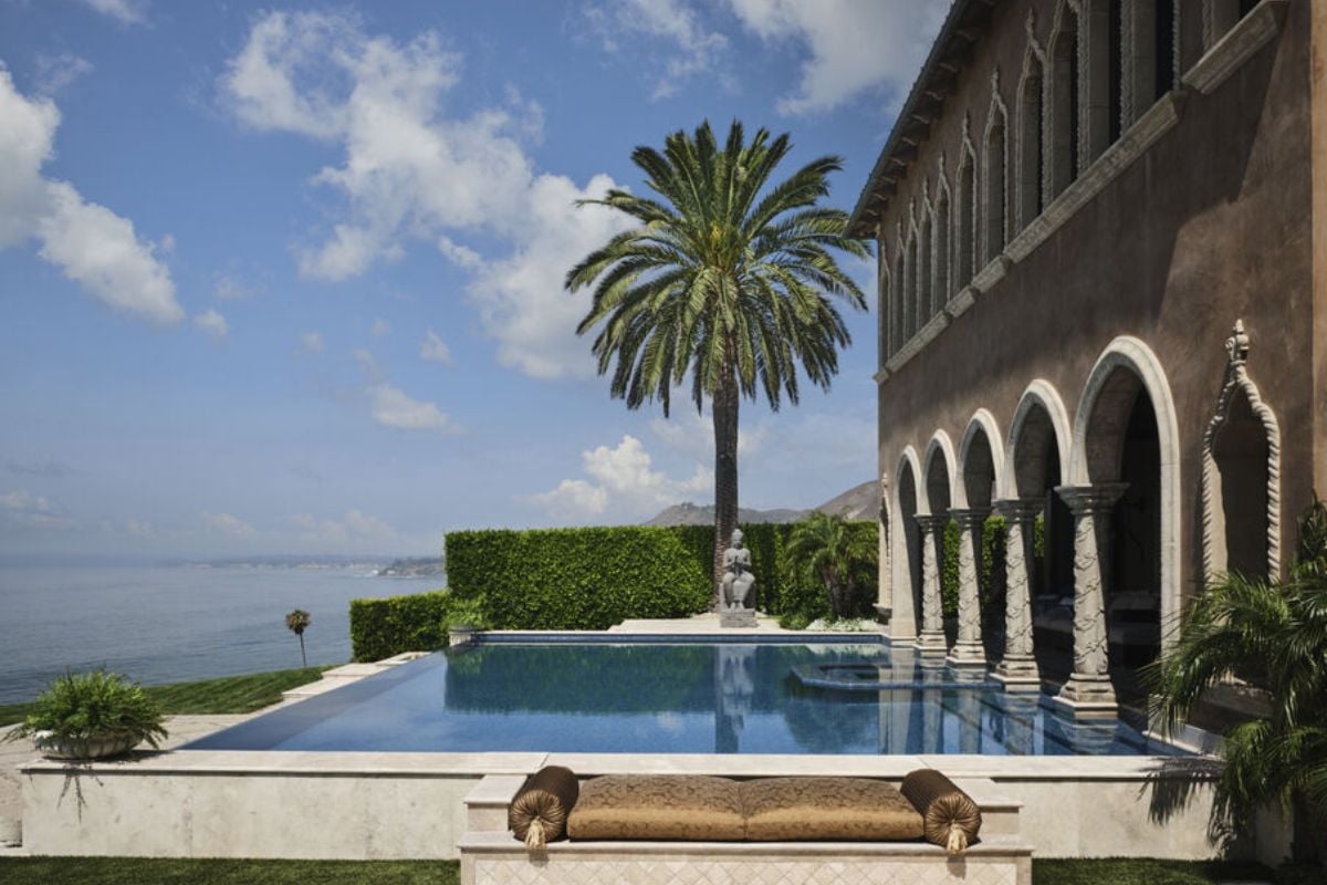 A swimming pool with trees and plants.