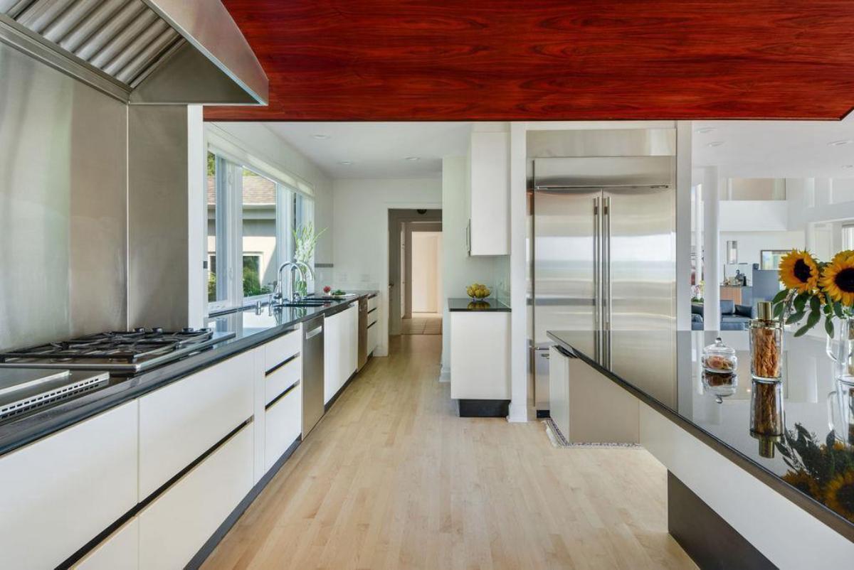 Kitchen with a large island and high-end appliances.