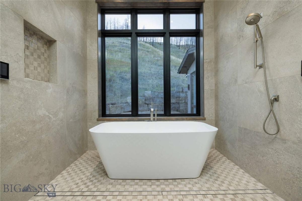 Bathroom with a soaking tub and shower.